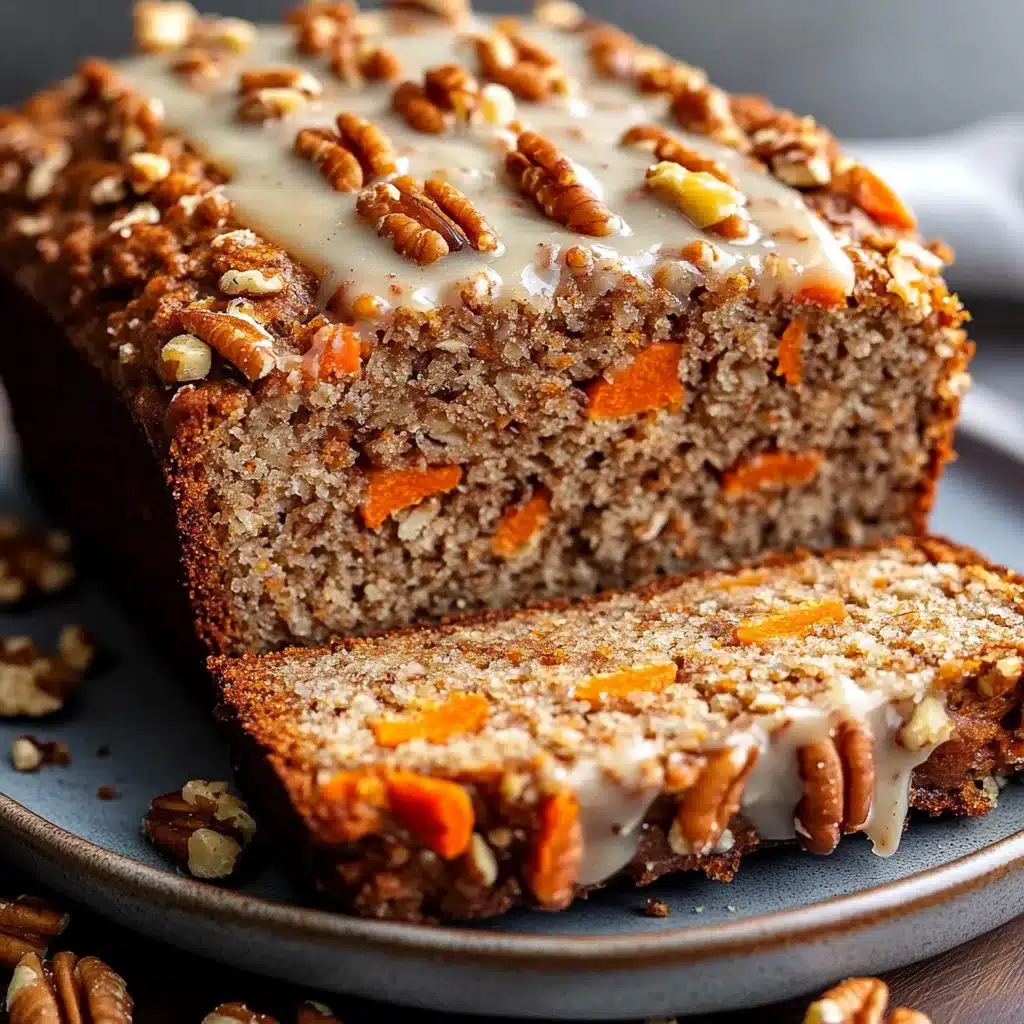Pan casero de avena, zanahoria y nuez recién horneado, servido en rebanadas sobre una tabla de madera.